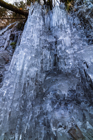 Beautifully shaped icicles on a mountain from a frozen waterfall