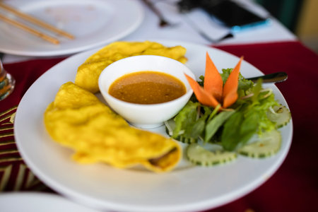 A plate of delicious Vietnamese pancake with loads of Vietnamese favourite herb--the basil leaves.