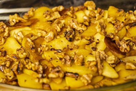 Wok with apple slices cooked for pieの写真素材