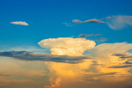 giant white cloud in the form of a mushroom in blue skies. beautiful cloudscape.