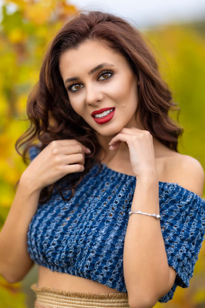 Portrait of young beauty lady  in the vineyards in autumn season.の写真素材