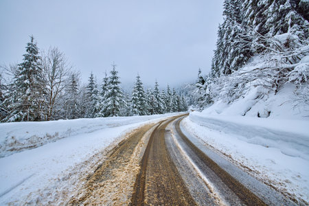 landscape with an empty mountain road in winter