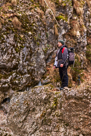 Professional photographer working in nature on a winter day in the mountains.の写真素材