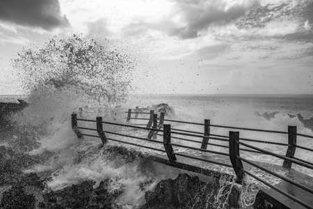 Waves crashing into the volcanic shoreline at a location named Water Blow on the Nusa Dua Peninsula.の写真素材