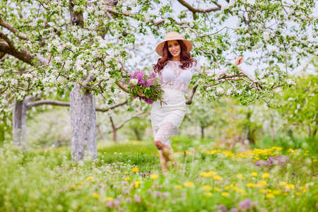 Beautiful natural woman in the garden of appleの写真素材
