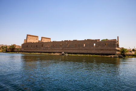 Edfu, ASWAN, EGYPT - 24 April 2021:  Temple of Isis at Philae island, in Lake Nasser, with bas-reliefs of Isis, Horus and the pharaoh.のeditorial素材
