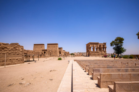 Edfu, ASWAN, EGYPT - 24 April 2021:  Temple of Isis at Philae island, in Lake Nasser, with bas-reliefs of Isis, Horus and the pharaoh.のeditorial素材