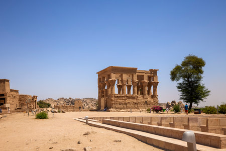 Edfu, ASWAN, EGYPT - 24 April 2021:  Temple of Isis at Philae island, in Lake Nasser, with bas-reliefs of Isis, Horus and the pharaoh.のeditorial素材