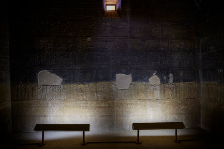 Edfu, ASWAN, EGYPT - 24 April 2021:  Temple of Isis at Philae island, in Lake Nasser, with bas-reliefs of Isis, Horus and the pharaoh.のeditorial素材