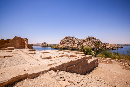 Edfu, ASWAN, EGYPT - 24 April 2021:  Temple of Isis at Philae island, in Lake Nasser, with bas-reliefs of Isis, Horus and the pharaoh.のeditorial素材
