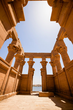 Edfu, ASWAN, EGYPT - 24 April 2021:  Temple of Isis at Philae island, in Lake Nasser, with bas-reliefs of Isis, Horus and the pharaoh.のeditorial素材