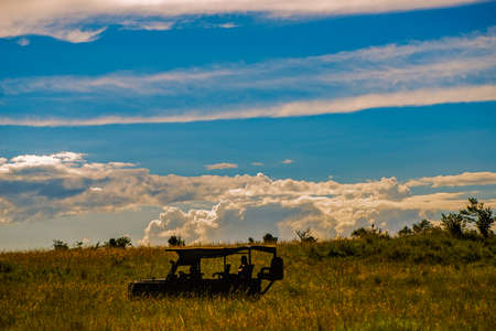 silhouette of a 4x4 vehicle in a Kenya safariの写真素材