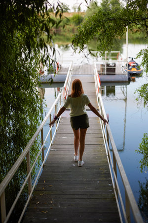 portrait of a woman on the edge of a lakeの写真素材