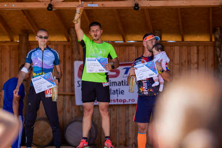 September 26, 2021: Romania, ArgeÈ, running competition Edition no. 1. Promoting sport at local level with the participation of people of different ages and genders (Podium)のeditorial素材
