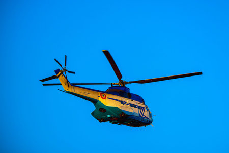 helicopter, military in flight against clear blue sky