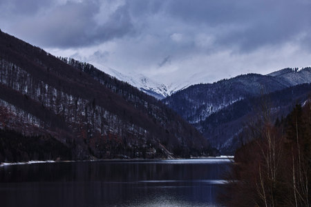 beautiful landscape with a mountain lake in winter