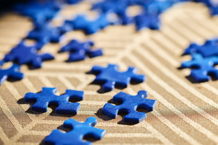 close up with puzzle pieces in blur backgroundの写真素材