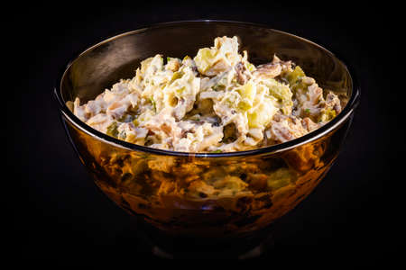 a bowl of chicken salad with mushroomsの写真素材