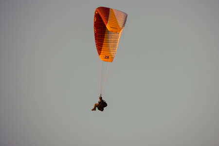 Valeni Arges Romania April 5, 2022: evening training of some skydiving enthusiasts at sunset.のeditorial素材