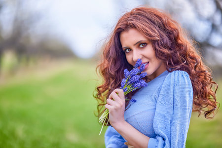 portrait of a beautiful brunette woman in spring nature.
