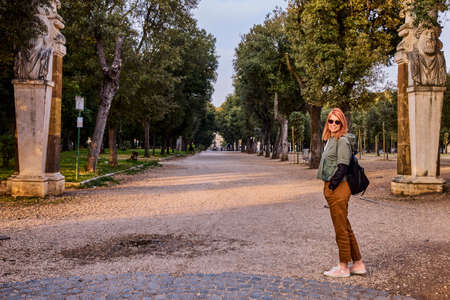 image of a tourist woman in a park in Romeの写真素材