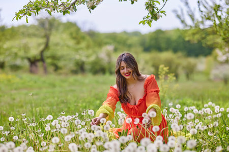 portrait of a woman in a dress in nature on a beautiful spring day