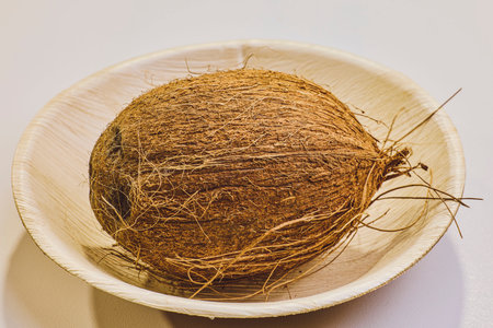 coconut in bamboo plate on a table