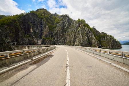 landscape with the Vidraru dam in the Carpathian mountains in Romania during springの写真素材