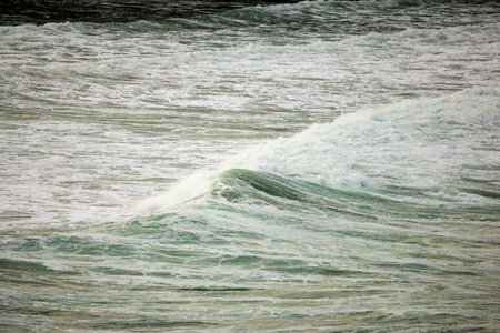 Abstract landscape with sea waves at the shore on a windy day.の写真素材