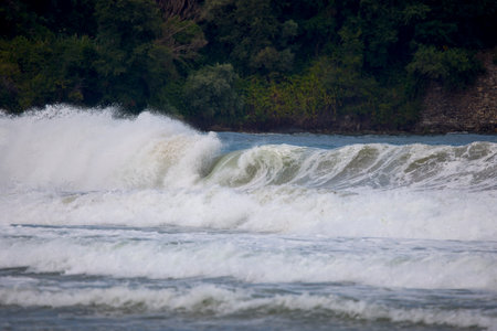 Abstract landscape with sea waves at the shore on a windy day.の写真素材