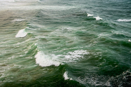 Abstract landscape with sea waves at the shore on a windy day.の写真素材