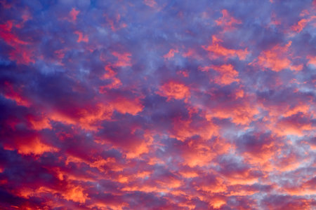 Beautiful landscape with a sky with red-orange hues created due to several meteorological factors.