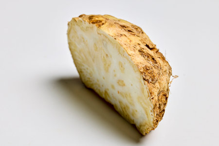 a celery root cut in half on a table.