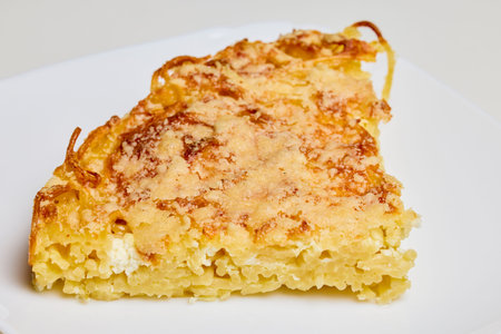 spaghetti with egg and parmesan cheese cooked in the oven, ready to eat.の写真素材