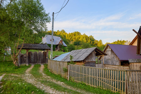 landscape with different traditional houses from Maramures, Romania, Houses built predominantly from wood.の写真素材