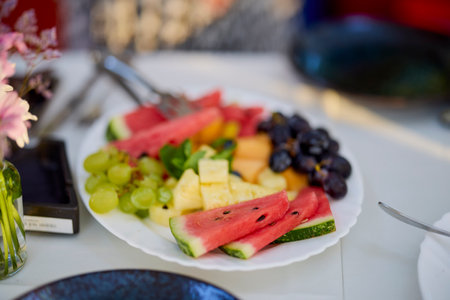 a plate of fresh fruit ready to serveの写真素材