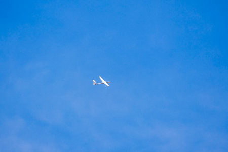an Glider in the sky during the dayの写真素材