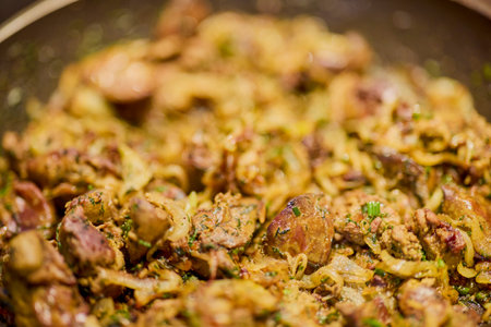 a pan with chicken liver, onion, garlic and dillの写真素材
