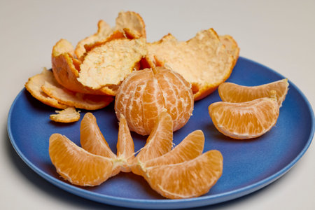 peeled clementines on a plate