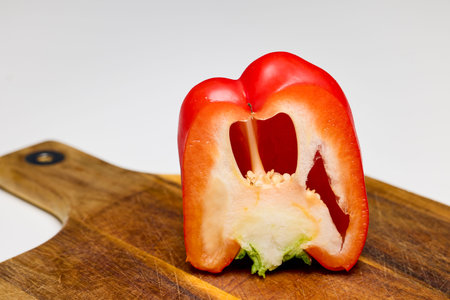 Red bell pepper in the section along the close-up on the background of the table