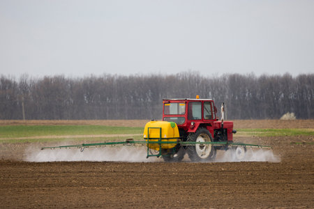 an agricultural machine that spreads herbicide on a fieldの写真素材
