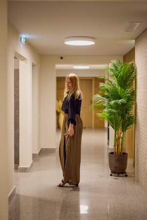 portrait of a middle-aged woman in a hallway at work.の写真素材