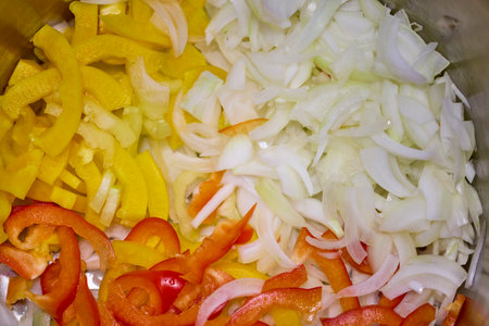 Mixed chopped vegetables for cooking, onion, yellow and red bell pepper, carrotの写真素材