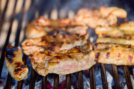 steak meat on a hot grill set to cookの写真素材