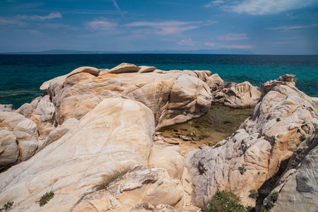 Beautiful landscape with rocky shore of the beach on the Mediterranean Sea in Greece, Travel concept.の写真素材