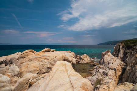 Beautiful landscape with rocky shore of the beach on the Mediterranean Sea in Greece, Travel concept.の写真素材