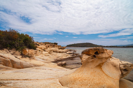 Beautiful landscape with rocky shore of the beach on the Mediterranean Sea in Greece, Travel concept.の写真素材
