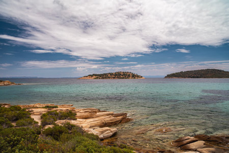 Beautiful landscape with rocky shore of the beach on the Mediterranean Sea in Greece, Travel...