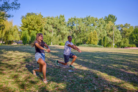 Father and daughter spending time together in the park exercising and relaxing.の写真素材