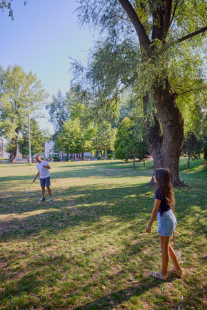 Father and daughter spending time together in the park exercising and relaxing.の写真素材